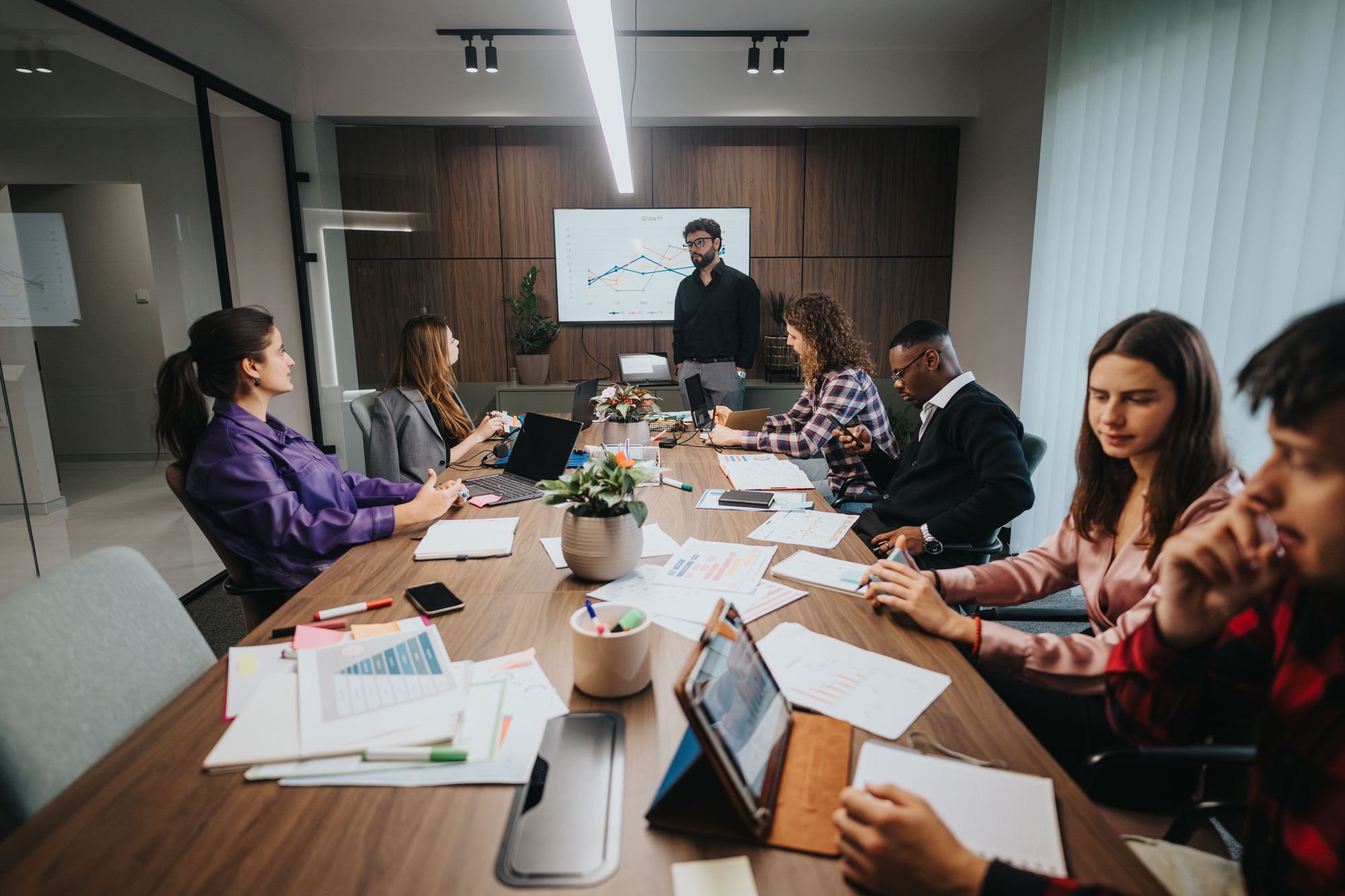 Group of people attend presentation